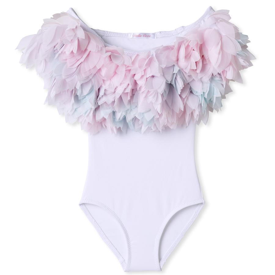 White swim suit with a pastel pink, green and blue chiffon petals across the chest and shoulders