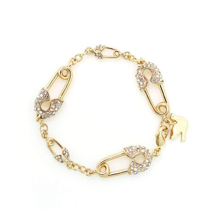 Gold bracelet with gold and crystal stud safety pins